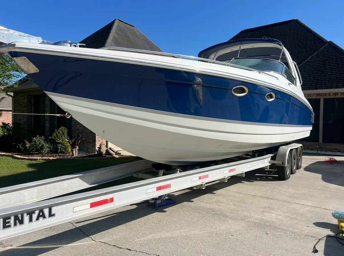Finished blue-and-white boat with a glossy hull.